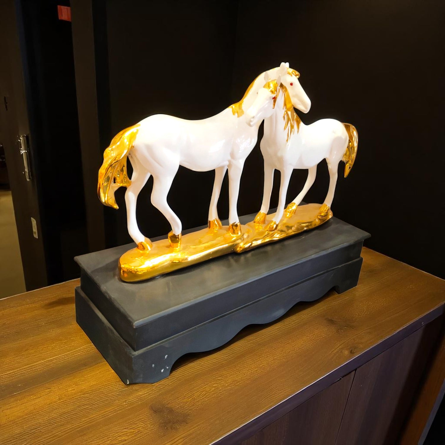 Side view of elegant white horses with golden detailing