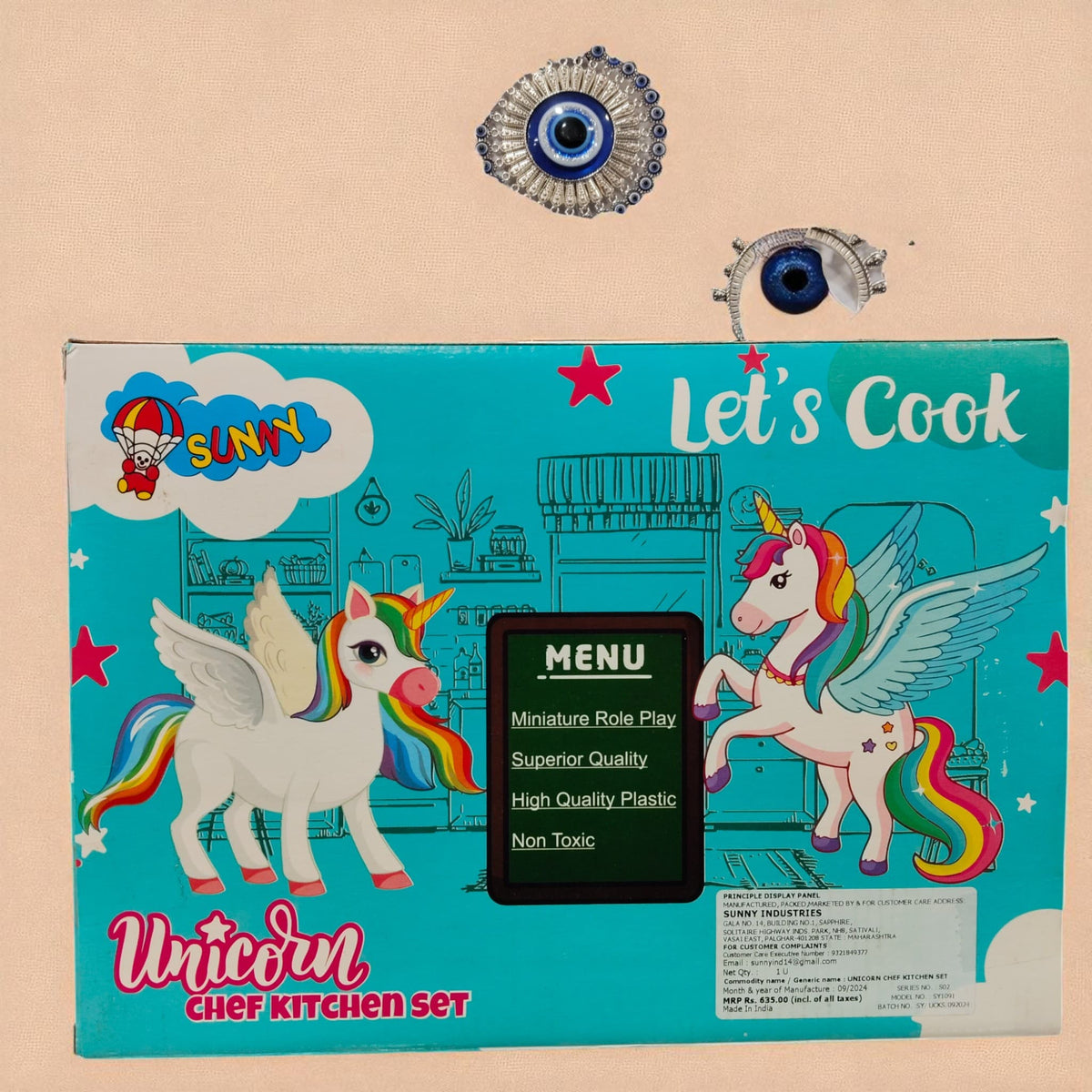 Back side of Unicorn Chef Kitchen Set box with colorful unicorn graphics and product details