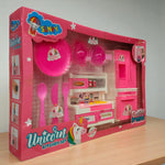 Side angled view of the Unicorn Kitchen Set toy box showing pink kitchen accessories and utensils with unicorn theme branding.