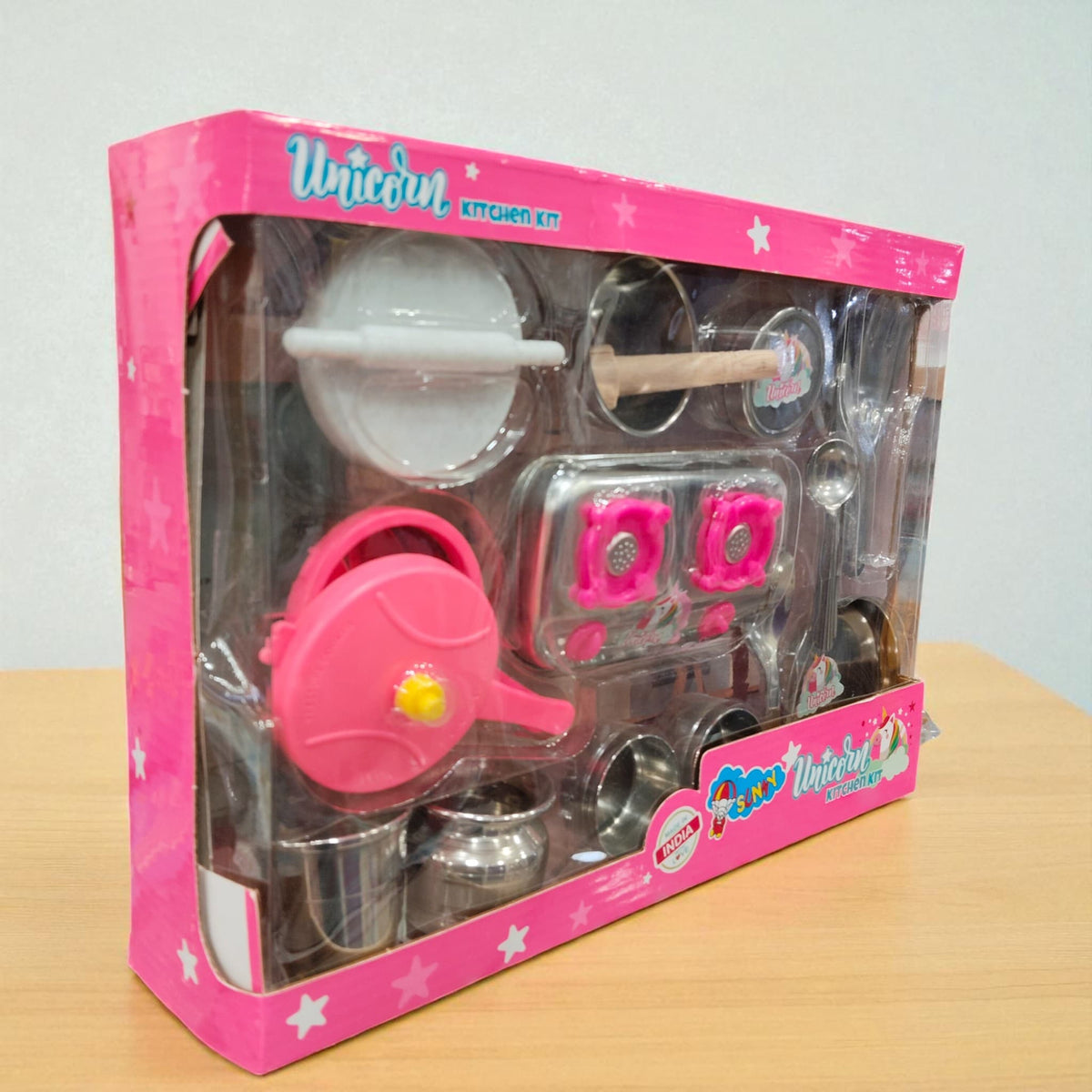 Angled view of Unicorn Kitchen Kit toy set box displaying pink stove and utensils.