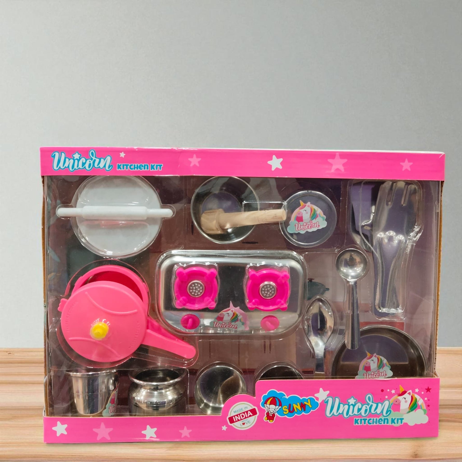 Front view of Unicorn Kitchen Kit toy set with stove, pots, and cooking tools for children.