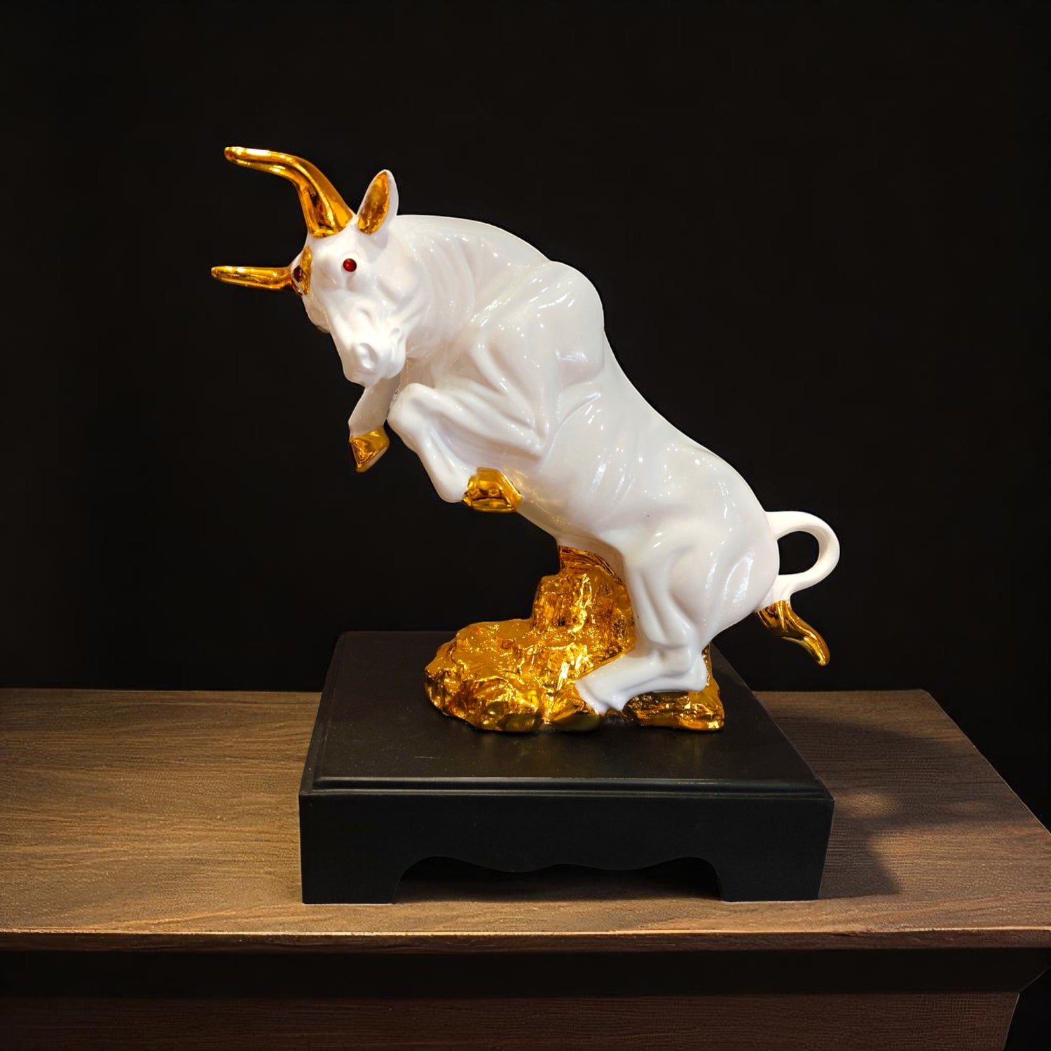 Front angle of white resin bull showpiece with golden base