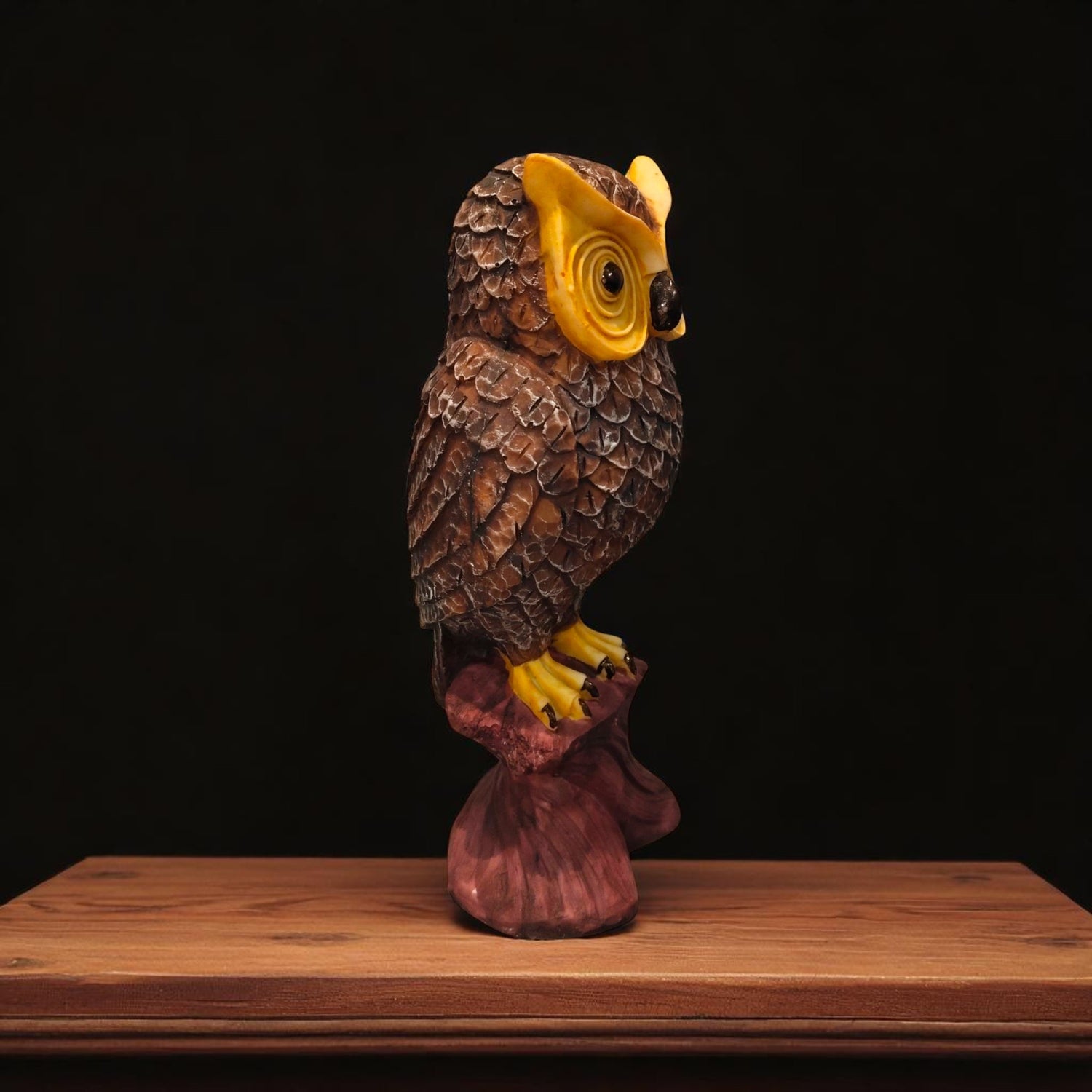 Side profile of wise owl statue for study and decor